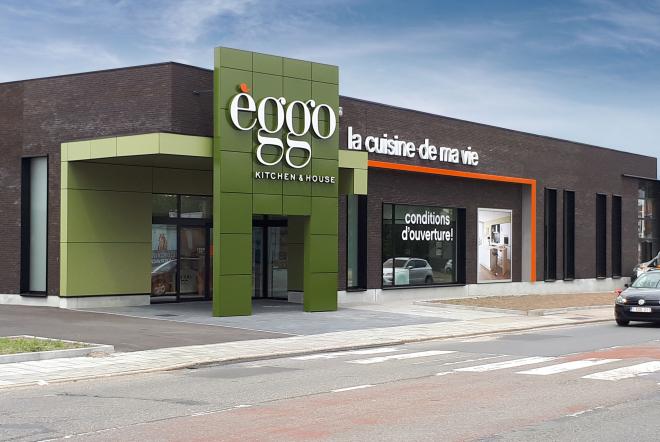 Façade d'un magasin èggo avec enseigne verte et noire, affichant "la cuisine de ma vie" et "conditions d'ouverture" sur des vitrines.